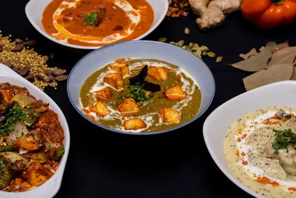 Curries & Puffs signature dishes - Paneer Puffs, Parathas and Curry Platters in Mill Woods Edmonton